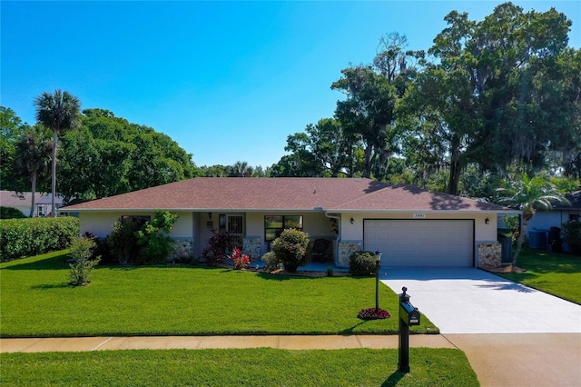 ranch-style home with an attached garage, a front lawn, driveway, and stucco siding