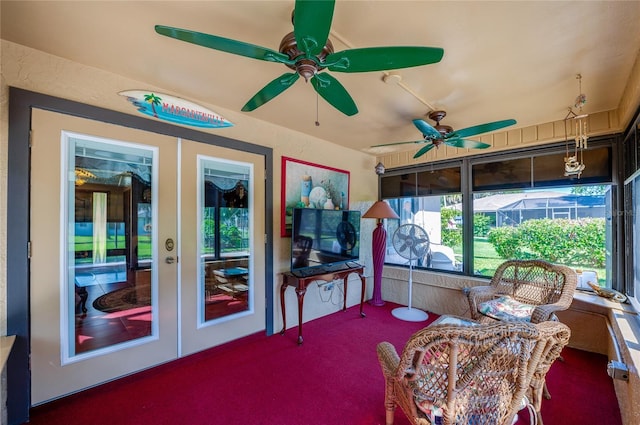 sunroom / solarium featuring french doors