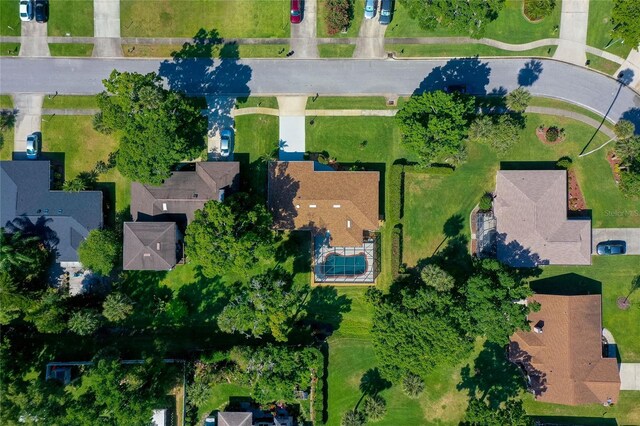 birds eye view of property with a residential view