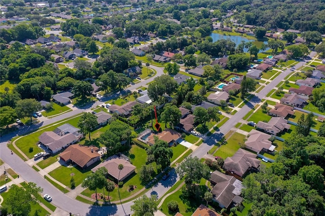 birds eye view of property featuring a residential view and a water view