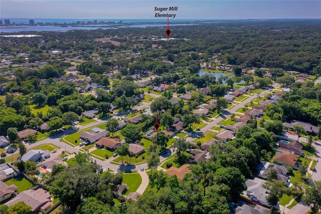 bird's eye view featuring a residential view and a water view