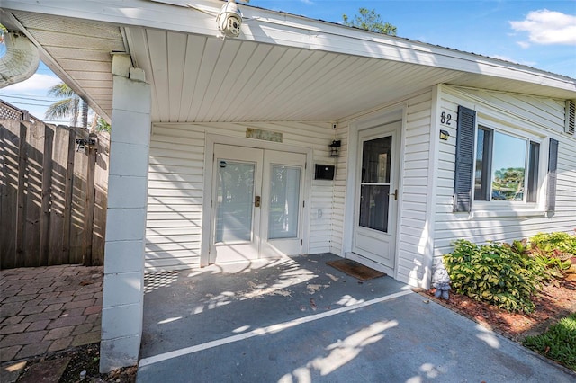 82 Margaret Rd, Ormond Beach, FL 32176 - property entrance with french doors and fence