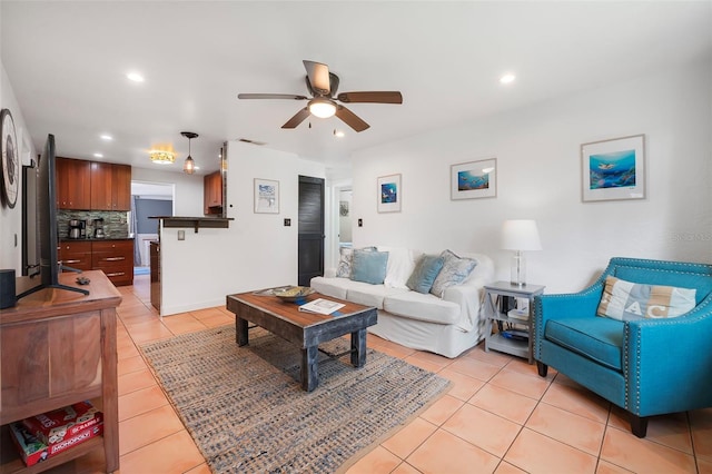 82 Margaret Rd, Ormond Beach, FL 32176 - living room with recessed lighting, ceiling fan, visible vents, and light tile patterned flooring