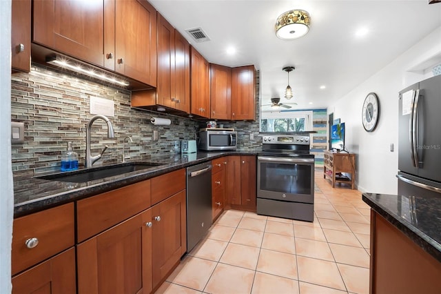 82 Margaret Rd, Ormond Beach, FL 32176 - kitchen featuring light tile patterned floors, backsplash, visible vents, appliances with stainless steel finishes, and a sink