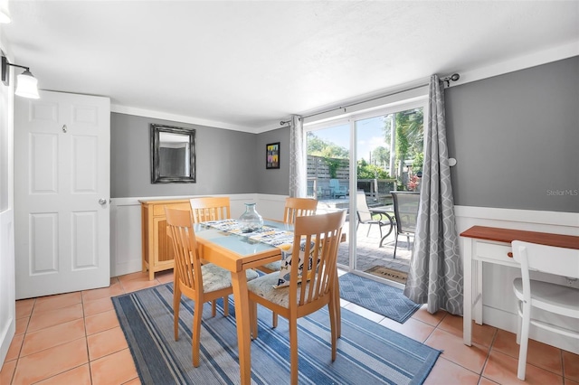 82 Margaret Rd, Ormond Beach, FL 32176 - dining space with light tile patterned flooring and wainscoting