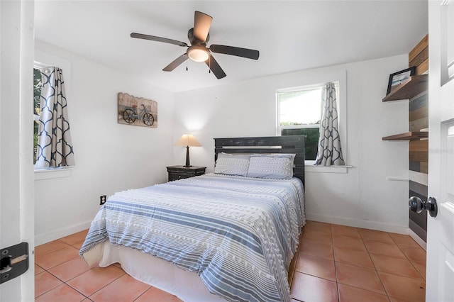 82 Margaret Rd, Ormond Beach, FL 32176 - bedroom featuring tile patterned floors, ceiling fan, and baseboards