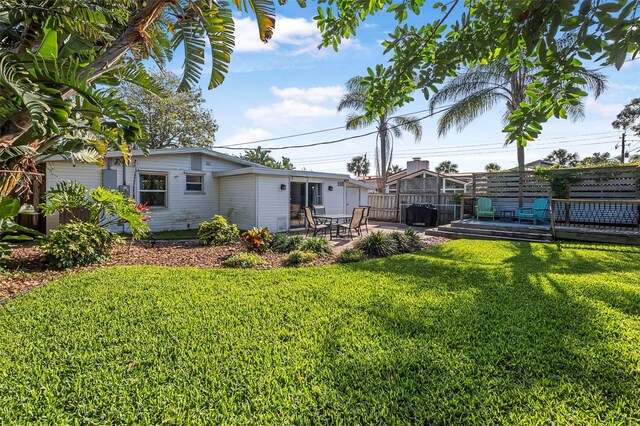 82 Margaret Rd, Ormond Beach, FL 32176 - view of yard with a patio, a wooden deck, and fence
