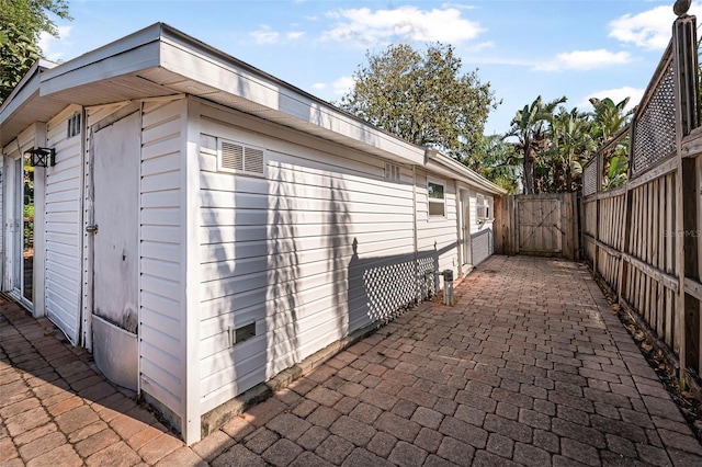 82 Margaret Rd, Ormond Beach, FL 32176 - view of outdoor structure featuring fence and a gate