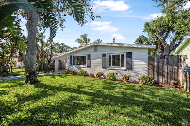 82 Margaret Rd, Ormond Beach, FL 32176 - view of front of property with a carport, a front yard, and fence