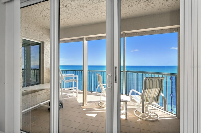 balcony featuring a water view