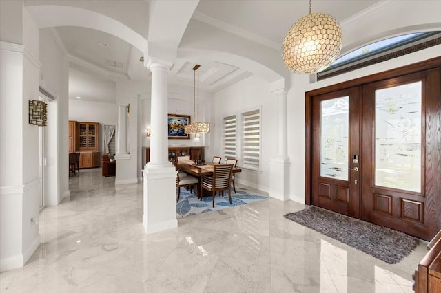 3310 John Anderson Dr, Ormond Beach, FL 32176 - entrance foyer with marble finish floor, ornate columns, and ornamental molding