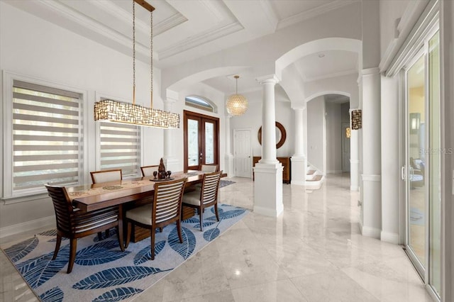 3310 John Anderson Dr, Ormond Beach, FL 32176 - dining area with arched walkways, a high ceiling, decorative columns, crown molding, and french doors
