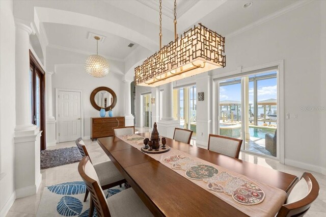 3310 John Anderson Dr, Ormond Beach, FL 32176 - dining space with a notable chandelier, ornate columns, and ornamental molding