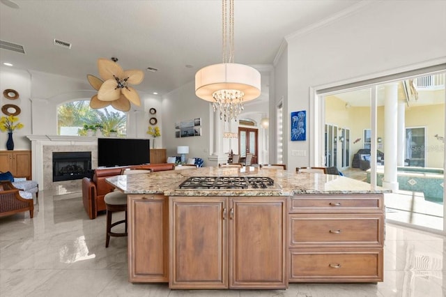 3310 John Anderson Dr, Ormond Beach, FL 32176 - kitchen featuring marble finish floor, light stone countertops, visible vents, and stainless steel gas cooktop