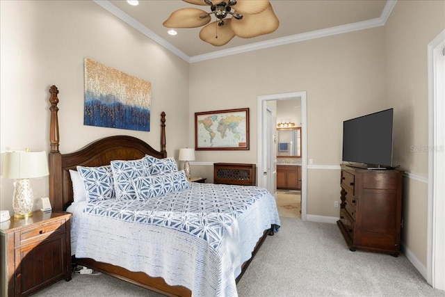3310 John Anderson Dr, Ormond Beach, FL 32176 - bedroom with baseboards, a ceiling fan, crown molding, connected bathroom, and light colored carpet