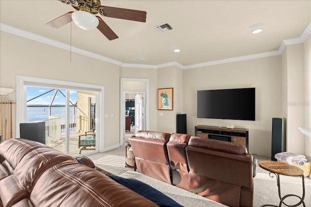 3310 John Anderson Dr, Ormond Beach, FL 32176 - living room with visible vents, baseboards, a ceiling fan, crown molding, and carpet flooring
