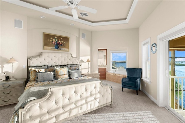 3310 John Anderson Dr, Ormond Beach, FL 32176 - bedroom featuring visible vents, multiple windows, and a tray ceiling
