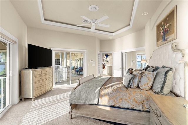 3310 John Anderson Dr, Ormond Beach, FL 32176 - bedroom with visible vents, access to exterior, light colored carpet, and a raised ceiling