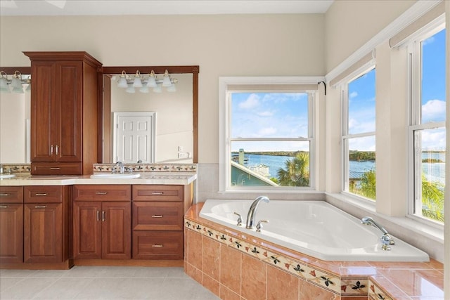 3310 John Anderson Dr, Ormond Beach, FL 32176 - full bathroom with a water view, tile patterned flooring, a bath, and vanity