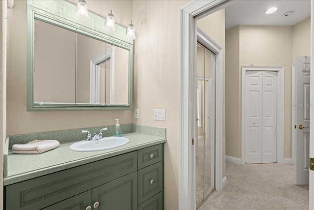 3310 John Anderson Dr, Ormond Beach, FL 32176 - bathroom featuring vanity, a closet, and baseboards
