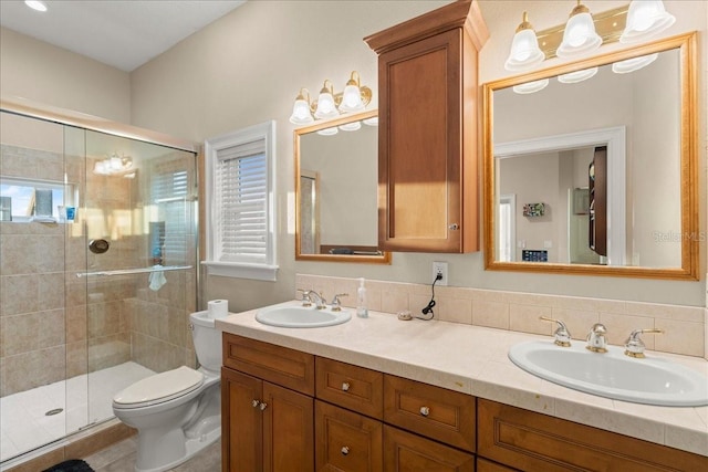 3310 John Anderson Dr, Ormond Beach, FL 32176 - bathroom featuring toilet, double vanity, a sink, and a shower stall