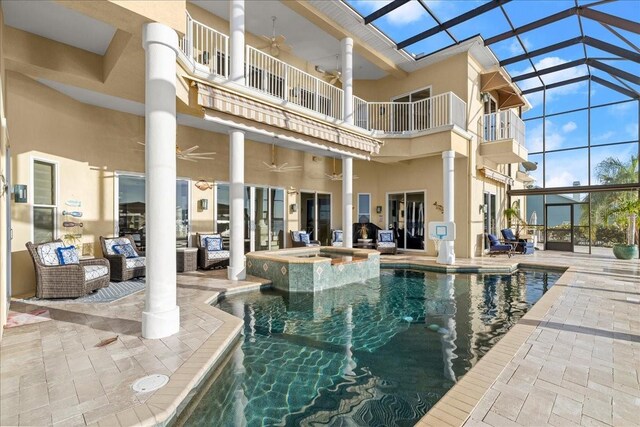 3310 John Anderson Dr, Ormond Beach, FL 32176 - view of swimming pool with outdoor lounge area, a patio area, ceiling fan, a pool with connected hot tub, and glass enclosure
