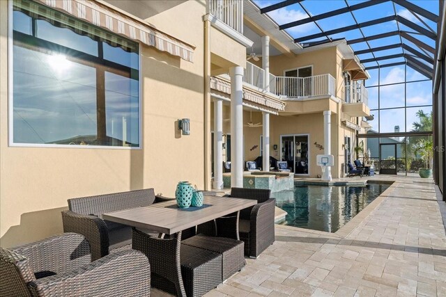 3310 John Anderson Dr, Ormond Beach, FL 32176 - exterior space with a patio area, a pool with connected hot tub, outdoor dining area, and a lanai