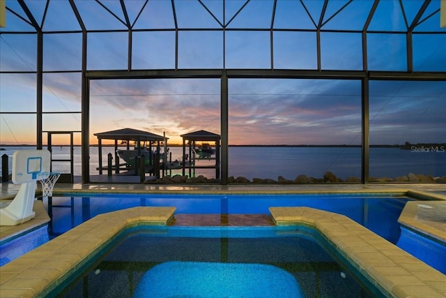 3310 John Anderson Dr, Ormond Beach, FL 32176 - view of pool with a water view, a pool with connected hot tub, and a lanai