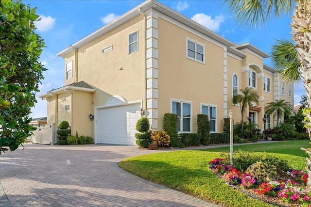 3310 John Anderson Dr, Ormond Beach, FL 32176 - exterior space with a garage and decorative driveway