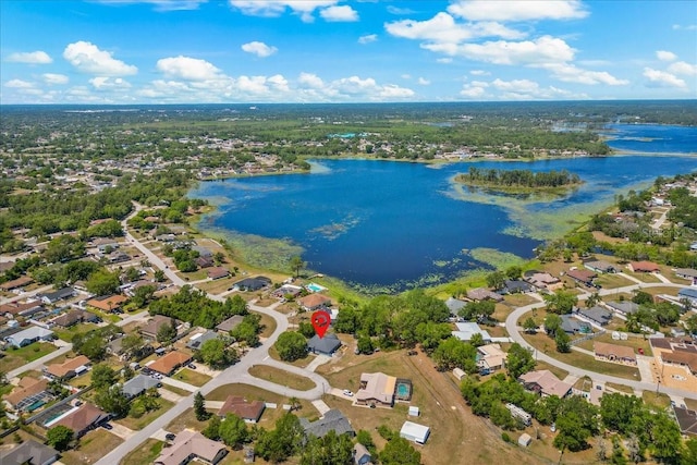 drone / aerial view featuring a water view and a residential view