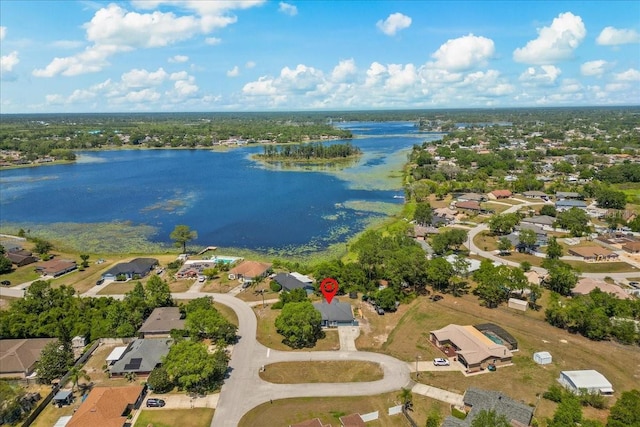 birds eye view of property featuring a water view and a residential view