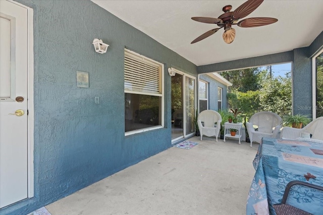 view of patio featuring ceiling fan