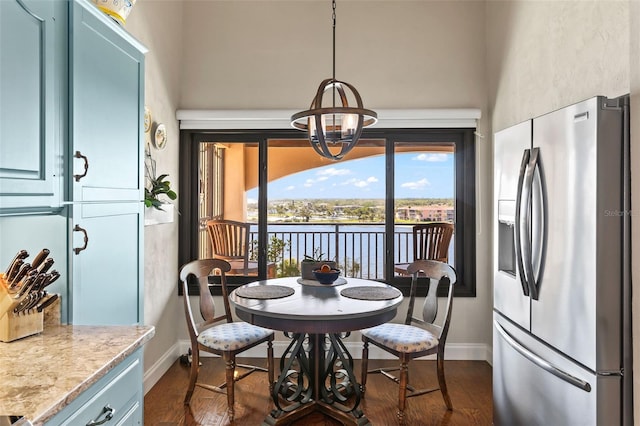 761 Marina Point Dr Unit 7610, Daytona Beach, FL 32114 - dining space featuring dark wood-style floors, baseboards, and an inviting chandelier