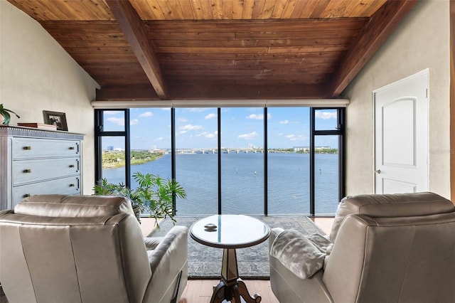 761 Marina Point Dr Unit 7610, Daytona Beach, FL 32114 - living area with a water view, wood ceiling, beam ceiling, and wood finished floors