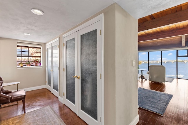 761 Marina Point Dr Unit 7610, Daytona Beach, FL 32114 - hall with baseboards, wood ceiling, beam ceiling, wood finished floors, and french doors