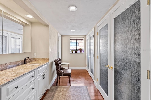 761 Marina Point Dr Unit 7610, Daytona Beach, FL 32114 - bathroom featuring vanity, recessed lighting, wood finished floors, french doors, and baseboards