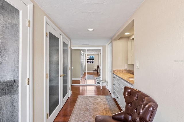 761 Marina Point Dr Unit 7610, Daytona Beach, FL 32114 - hallway with dark wood-style flooring and baseboards