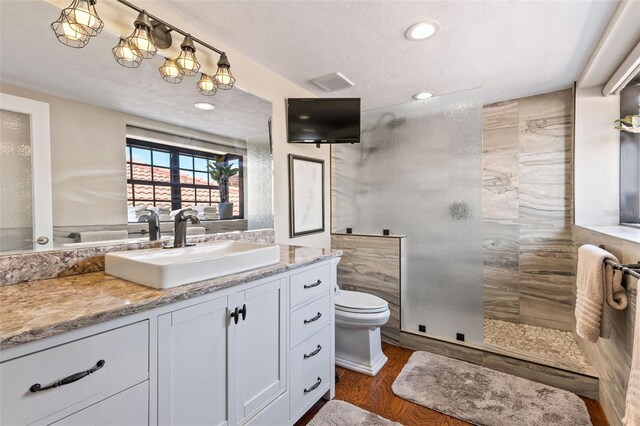 761 Marina Point Dr Unit 7610, Daytona Beach, FL 32114 - bathroom with vanity, recessed lighting, toilet, a walk in shower, and wood finished floors