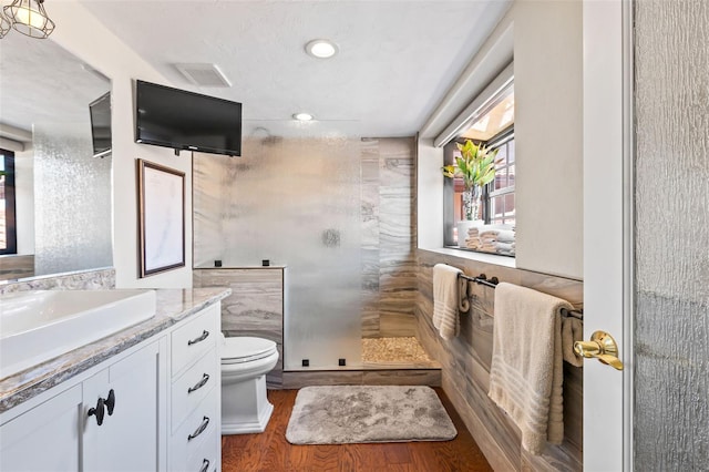 761 Marina Point Dr Unit 7610, Daytona Beach, FL 32114 - bathroom featuring vanity, walk in shower, toilet, and wood finished floors
