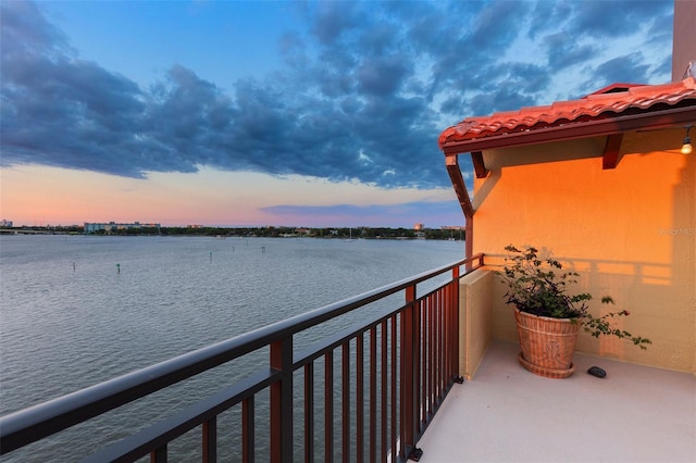 761 Marina Point Dr Unit 7610, Daytona Beach, FL 32114 - balcony at dusk featuring a water view