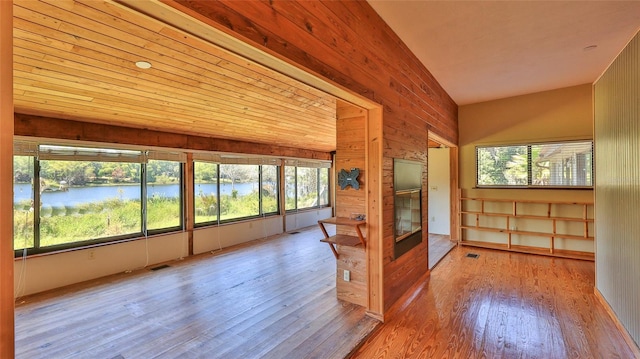 160 Rose Ave, Lake Helen, FL 32744 - unfurnished sunroom featuring wood finished floors, a water view, plenty of natural light, and visible vents