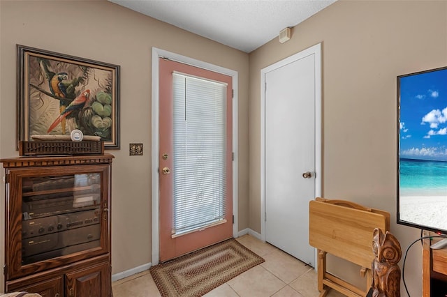 8 Faith Ln, Palm Coast, FL 32137 - entryway with light tile patterned flooring and baseboards