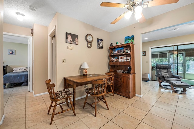8 Faith Ln, Palm Coast, FL 32137 - home office with light tile patterned floors, baseboards, a textured ceiling, and ceiling fan