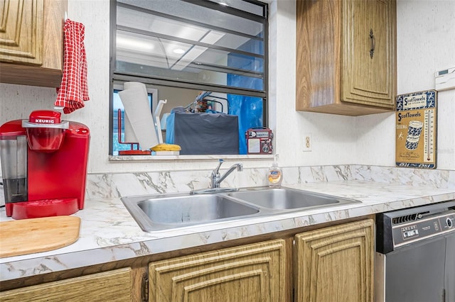 8 Faith Ln, Palm Coast, FL 32137 - kitchen featuring light countertops, a textured wall, a sink, and dishwashing machine