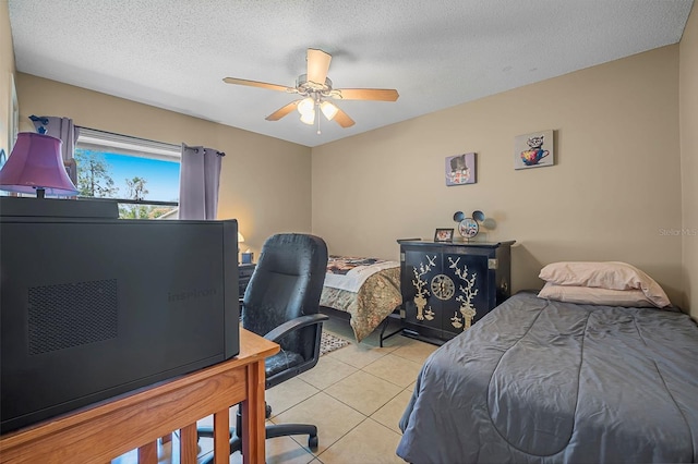 8 Faith Ln, Palm Coast, FL 32137 - bedroom with light tile patterned floors, a textured ceiling, and ceiling fan