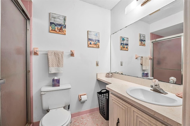 8 Faith Ln, Palm Coast, FL 32137 - bathroom featuring baseboards, toilet, vanity, tile patterned floors, and a shower with door