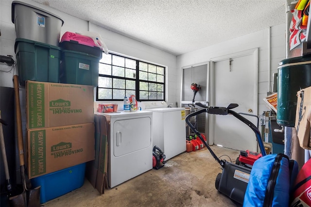 8 Faith Ln, Palm Coast, FL 32137 - laundry room featuring separate washer and dryer, laundry area, and a textured ceiling