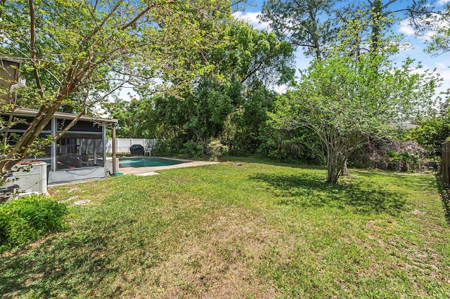 8 Faith Ln, Palm Coast, FL 32137 - view of yard featuring an outdoor pool, a fenced backyard, and a sunroom