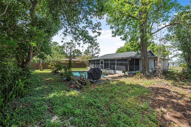 8 Faith Ln, Palm Coast, FL 32137 - view of yard with a sunroom, a fenced backyard, and a fenced in pool