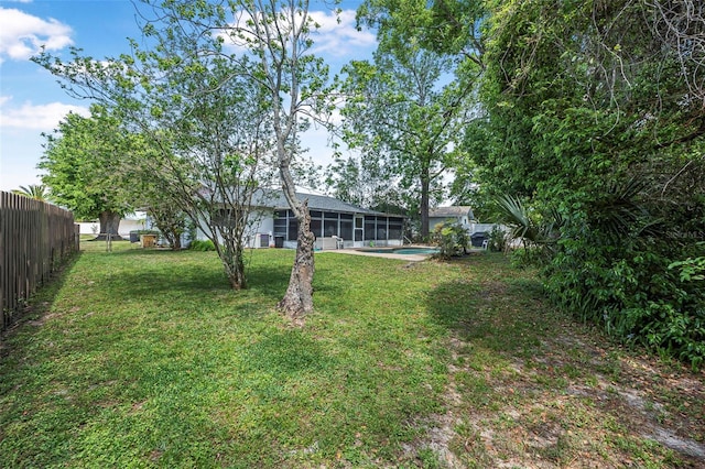 8 Faith Ln, Palm Coast, FL 32137 - view of yard featuring a fenced backyard and a sunroom